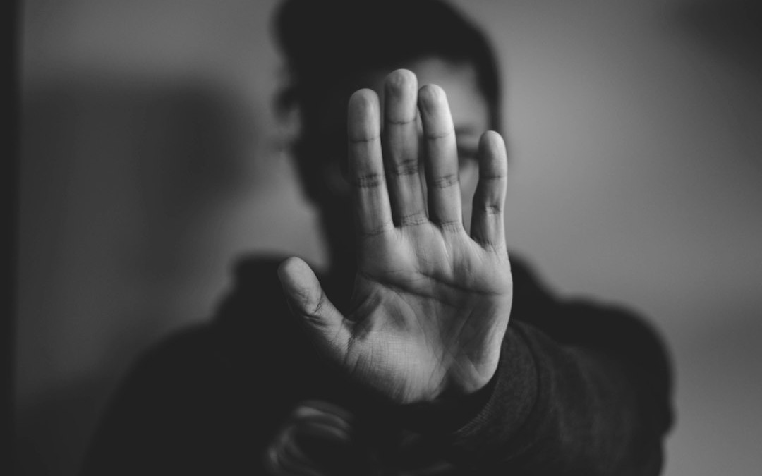 close-up photography of person lifting hands